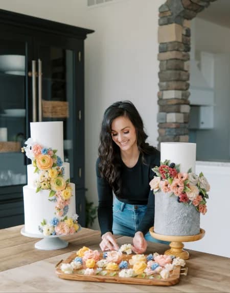 Instructor smiling while working on a decorated cake